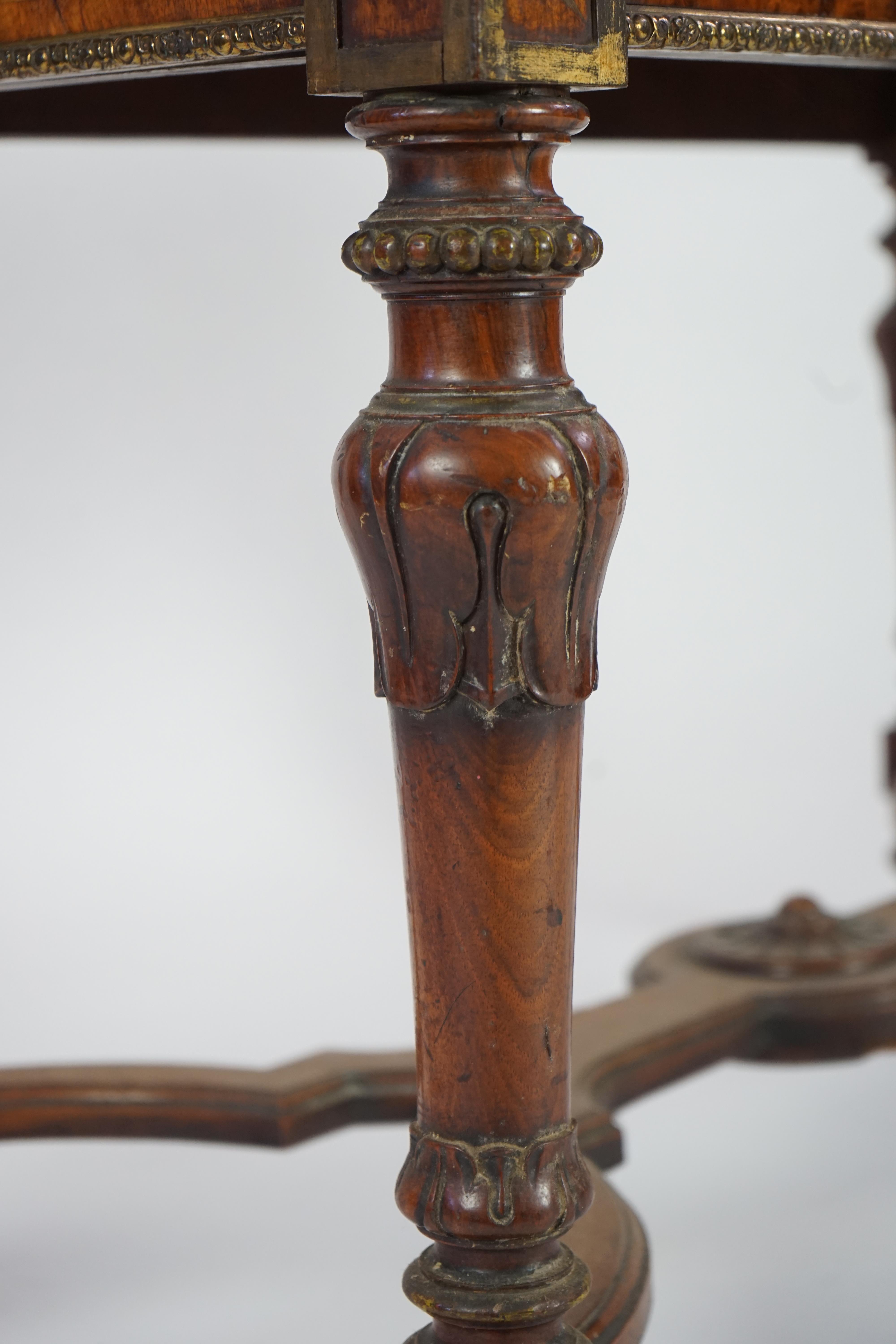 A mid Victorian ormolu mounted walnut pietra dura top centre table